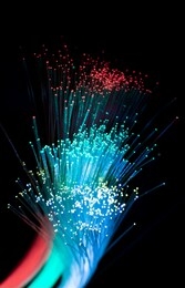 fiber optics network cable for ultra fast internet communications, thin light threads that move information at high speed.