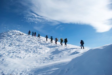 hikers in a winter mountain