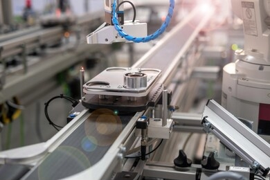 close up of an automated car brings product to assembly station of smart factory prototype. industry 4.0 smart manufacturing concept using artificial intelligence and internet of things in production.
