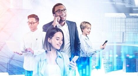 happy diverse business team working together in abstract city with double exposure of blurry graphs. toned image