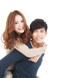 happy asian young couple hugging together