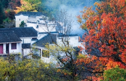 ancient buildings in the mountains, reflecting the red leaves in autumn, chizhou city, anhui province, china.