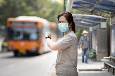asian woman wearing hygienic mask to preventing new viruses,epidemic,spread of diseases, coronavirus,mers-cov ,respiratory disease,air contamination,dust,pm2.5,air pollution problems,health care