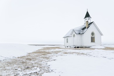 prairie church on a foggy winter day 