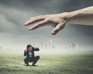 big human hand catching businessman. professional relations