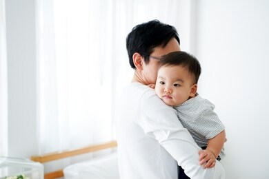 happy asian father and baby boy toddler at home, enjoying family time together