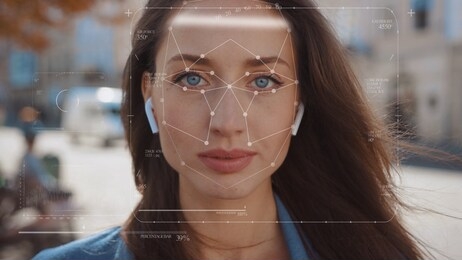 future. face detection. technological 3d scanning. biometric facial recognition. face id. technological scanning of the face of beautiful caucasian woman in the city for facial recognition. shoted by
