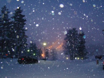 finland. winter evening. it's snowing.
