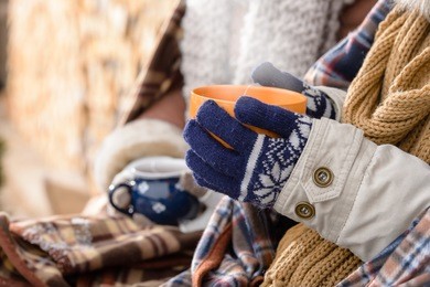winter hot tea hands holding steaming mug countryside cottage