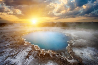 incredibly blue pool blahver at hveravellir is actually a hot geothermal spring in the heart of iceland. photo taken around midnight sunset