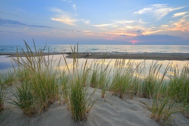 sunset on lake michigan sand dunes near pentwater