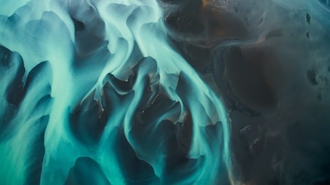 blue glacier river in iceland from an aerial perspective