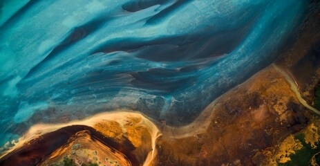 aerial view from above on a green and blue glacier river stream in 
south iceland. beautiful patterns, textures and structures. melting glacier,  global warming and climate change concept