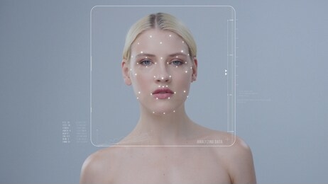 face id. future technology concept. technological biometric identification of young blonde beauty woman isolated on dark grey background. 3d facial recognition and personal security. augmented reality