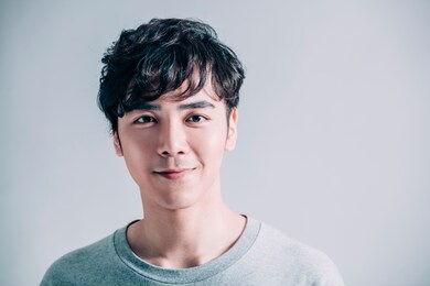  portrait of young smiling handsome man isolated on gray background