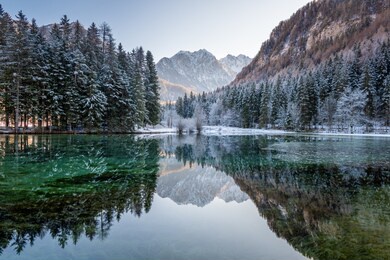 beautiful reflection in lake, slovenia plansarsko jezerko, zgornje jezersko at winter. holidays destination, hiking.