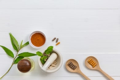 herbal supplement in capsules with healthy medicinal plant.alternative drug or natural pharmaceutical capsule.medication of vitamin supplemental for care and treatment.top view.