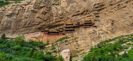 chinese temple in a cliff. xuankong hanging monastery in datong shanxi, china (text in red: xuankong monastery)