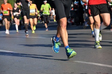 marathon running race, people feet on road, sport, fitness and healthy lifestyle concept 