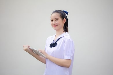 asia thai junior high school student uniform beautiful girl using her tablet