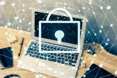 double exposure of desktop with computer and lock icon hologram. concept of data safety.