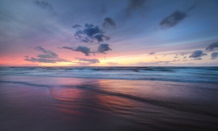 stunning sunset sky above the baltic sea, denmark. storm waves and colorful clouds. long exposure