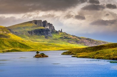 landscape view of old man of storr rock formation and lake, scotland, united kingdom