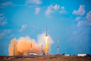 a real rocket in flight, a launch vehicle from a spaceport. take-off rocket in the sky against the background of clouds. launch concept, the power of science and technology. modern technology.