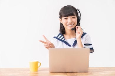 asian girl studying with a pc,school uniform,correspondence course