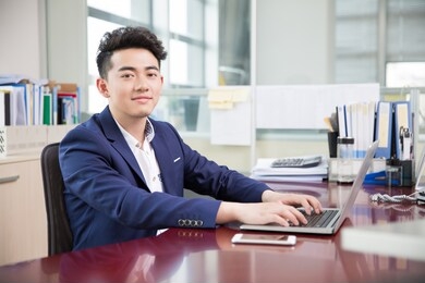 handsome handsome chinese man, owner of a company