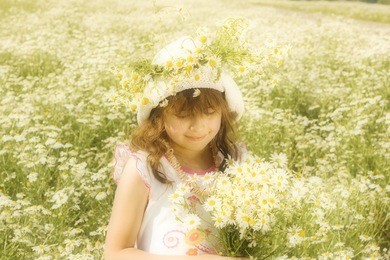 smiling girl playing on the meadow