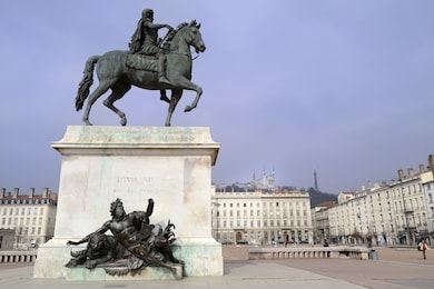 lyon, france. place bellecour, fourviere basilica and hill. traditional buildings in a sunny day