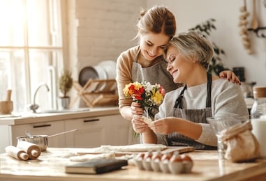 happy mother's day! family old grandmother mother-in-law and daughter-in-law daughter congratulate on the holiday, give flowers 

