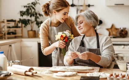 happy mother's day! family old grandmother mother-in-law and daughter-in-law daughter congratulate on the holiday, give flowers 
