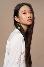 beautiful woman dark hair catkins makeup shirt