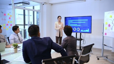 business concepts. businessmen are presenting sales at the meeting.