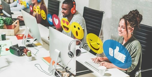 young trendy teamwork using computer in creative coworking office - business people working together at new app project - focus on left woman face - technology, influencer, marketing and job concept