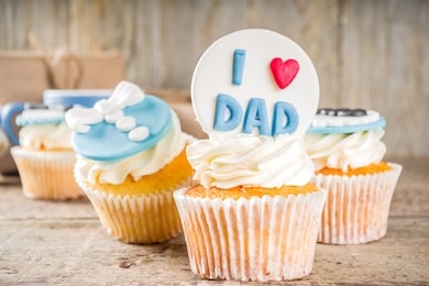 happy father’s day greeting card.  greetings and presents for dad's day - gift box, coffee tea cup, tie, homemade special cupcakes. 