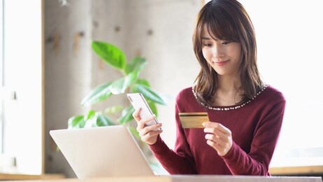young asian woman using credit card online shoping