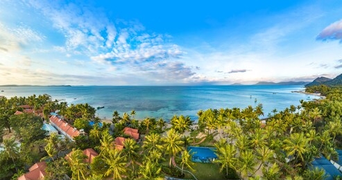 coastal resort scenery of phu quoc island during sunset, vietnam, a popular tourism destination for summer vacation in southeast asia, with tropical climate and beautiful landscape. aerial view.