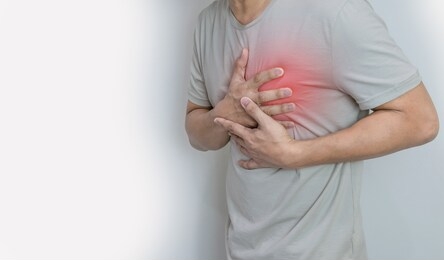 hands holding chest with symptom heart attack disease