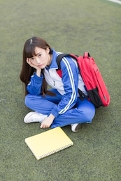 cute chinese female high school students on the campus playground learning