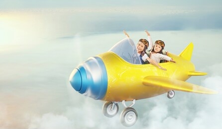 two sisters fly in sky with retro cute airplane . dreams come true  imagination concept .