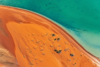 an aerial view of sand dunes and the beach in the shark bay region of western australia. image captured shooting out of a cessna with the door off.