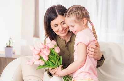 loving teen little girl preparing surprise for mother on mothers day, 12th may