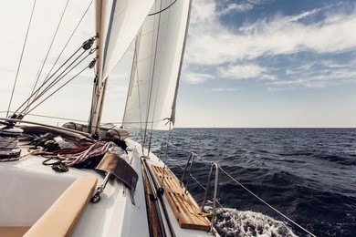 sailing ship yachts with white sails in the open sea