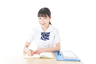 uniformed young student study at the desk