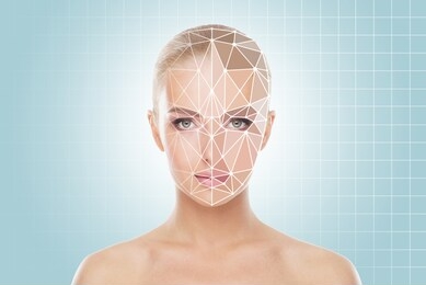 face of a beautifyl girl with a scanning grid on her face. face id, security, facial recognition, authentication technology.