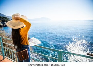asian girl traveling in genova nervi, italy 