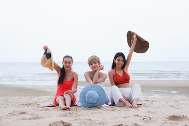 portrait three asian women, girls group friends having fun together on the beach 